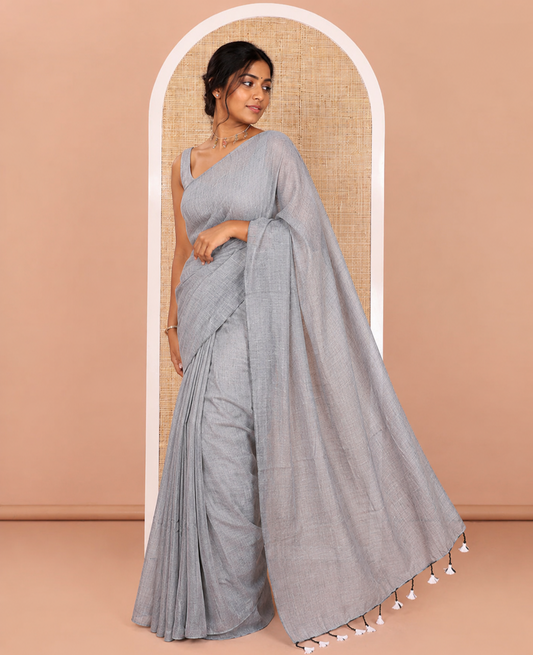Borderless Grey Plain Khadi Mul Cotton Saree Featuring a Self Pallu with Tassels, Paired with a Matching Plain Blouse