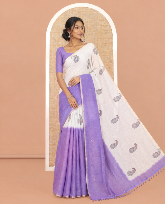 Cream-Purple Linen Cotton Saree Features Paisley Butta and Mirror Work, a Piping Border, a Self-Pallu, a Contrast Blouse