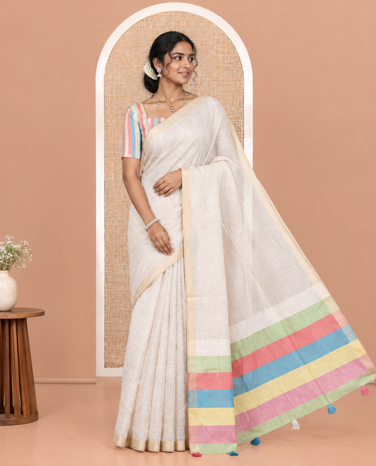 Cream Plain Semi-Tussar Saree, a Zari Border, Multi-Colored Striped Pallu, and a Contrast Blouse