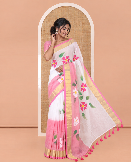 Cream and Pink Khadi Mul Cotton Saree, Adorned with Hand-Brush Painting-Style Floral Block Printed Body, a Subtle Gold Zari Border, a Self-Pallu, and Paired with a Matching Blouse