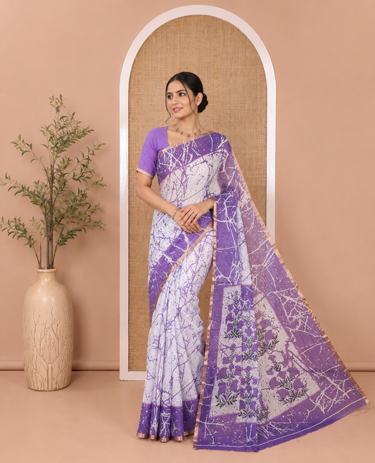 Cream and Lavender Linen Cotton Saree, Decked Up with Batik Print on Its Body, Complemented by Contrast Batik Printed Border, Pallu of Floral Print, and Paired with a Contrast Blouse