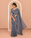Borderless Elephant Grey Plain Khadi Mul Cotton Saree Featuring a Self Pallu with Tassels, Paired with a Matching Plain Blouse