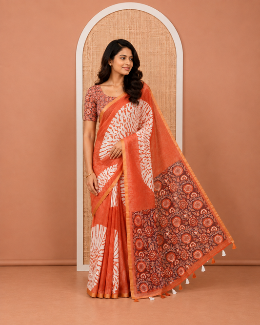 Rust Linen Cotton Saree, Elevated with Floral Motifs Printed on Its Body, Subtle Piping Border, Complemented by a Contrast Floral Printed Blouse, and Paired with a Contrast Blouse