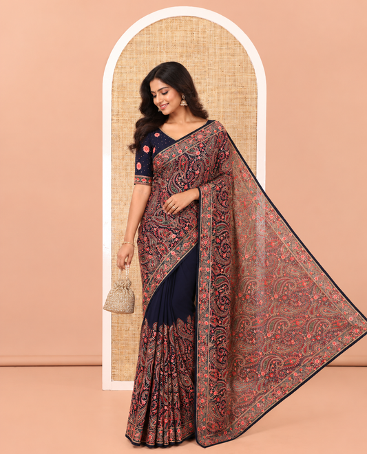 Navy Blue Georgette Saree, Ornamented with Intricate Paisleys, Kashmir Embroidered and Stone Work on Its Body, a Self-Embroidered Border, and Paired with an Embroidered Blouse