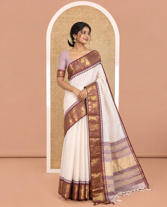 White Semi-Taffeta Saree, Adorned  with Medium-Zari Checks All Over Its Body, Complemented by Contrast Temple Border Featuring Elephant Motifs, Contrast Checked Pallu, and Paired with a Matching Blouse