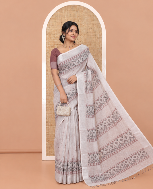Chikku Linen Saree, Decorated with Buttas and Geometric Print on Its Body, Highlighted by Zari Bavanji Border, Pallu of Same Geometric Print, and Paired with a Contrast Blouse