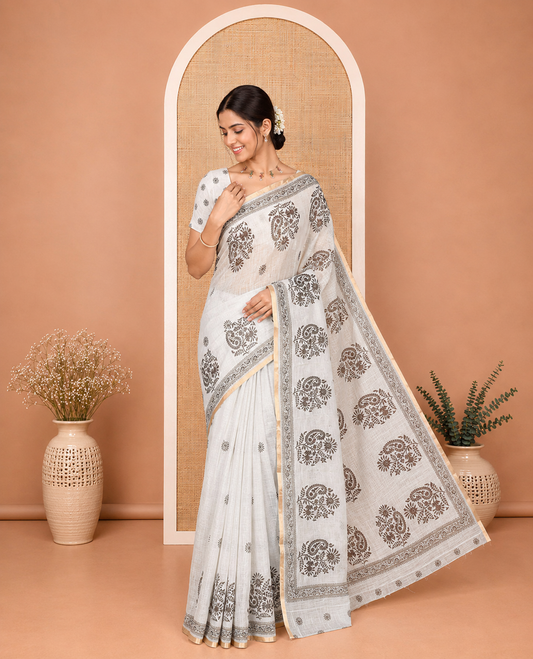 Pista Linen Cotton Saree, Bedecked with Floral-Paisley Motifs Print All Over Its Body, Highlighted by Gold Zari Printed Border, Floral-Paisley Printed Pallu and Paired with a Matching Blouse
