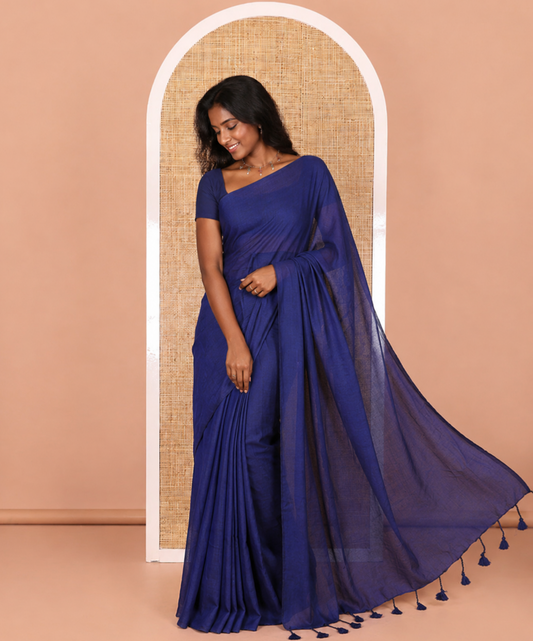 Borderless Blue Plain Khadi Mul Cotton Saree Features a Self-Pallu with Tassels, and a Matching Blouse