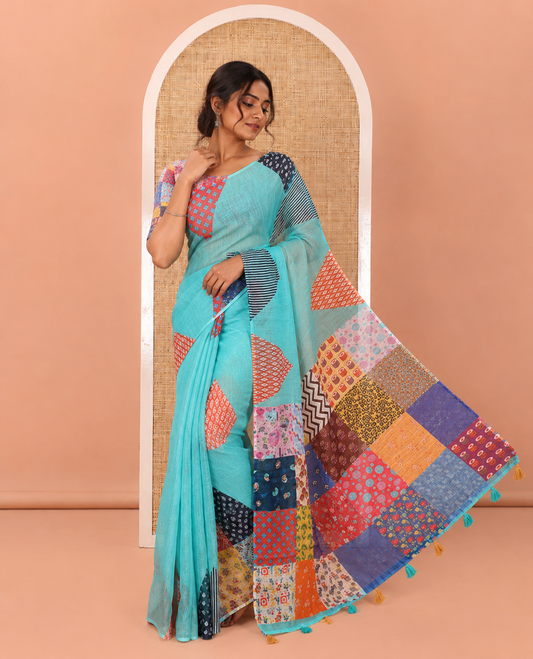 Blue Plain Linen Cotton Saree, Complemented by a Contrast-Colored Triangle on Its Border, Kaleidoscopic-Color Patchwork Pallu, and Paired with a Contrast Blouse