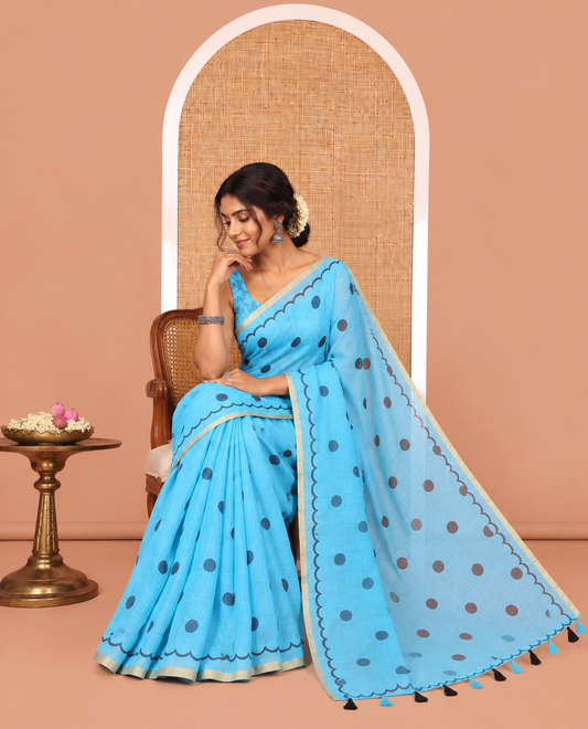 Blue Linen Cotton Saree, Beautified with Polka Dots All Over Its Body, Subtle Piping Border, Self-Pallu, and Paired with a Floral Printed Matching Blouse