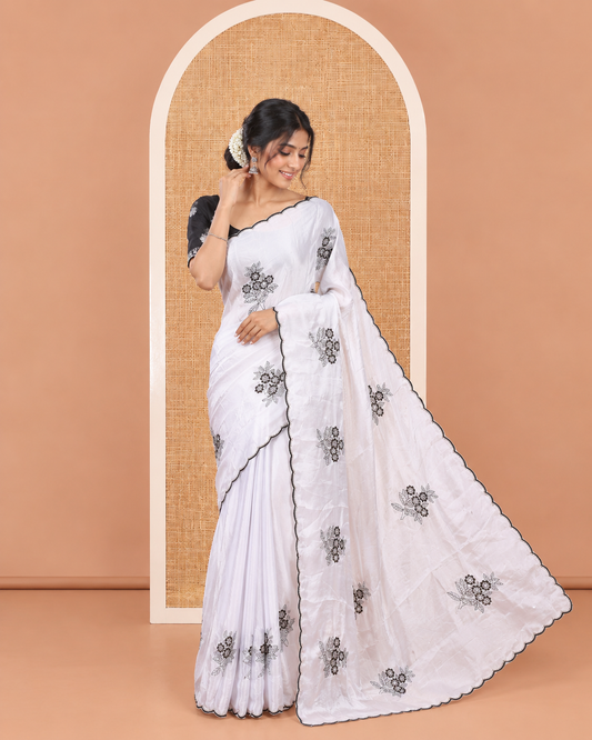 Grey Rangoli Chiffon Saree, Ornamented with Flower-Style Motifs Embroidered on Its Body, a Subtle Scallop Embroidered Border, a Self-Pallu, and Paired with a Contrast Embroidered Blouse