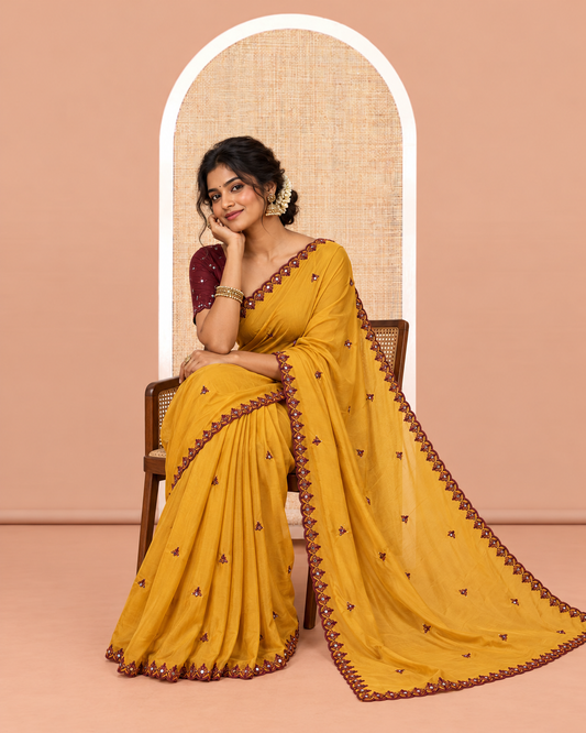 Yellow Rangoli Chiffon Saree, Accentuated with Thread and Mirror Work Buttas on Its Body, Subtle Scallop Embroidered Border, Embroidered Pallu, and Paired with a Contrast Mirror Work Blouse