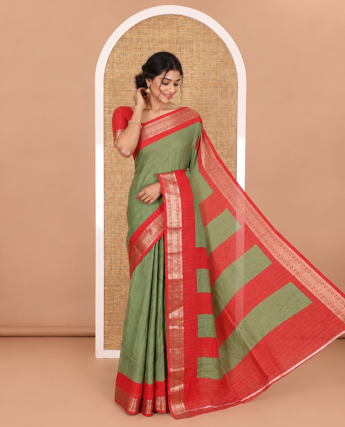 Green vertically striped moss chiffon saree with contrast traditional zari design borders, striped pallu, and a contrast blouse