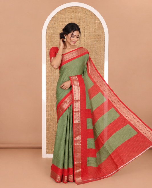Green vertically striped moss chiffon saree with contrast traditional zari design borders, striped pallu, and a contrast blouse