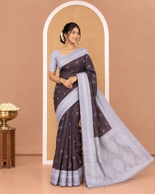 Black Katan Silk Saree, Subtly Steeped with Leaf Motifs Printed All Over Its Body, Complemented by a Contrast Traditional Patterned Border, Pallu Depicting Intricate Designs, and Paired with a Contrast Blouse