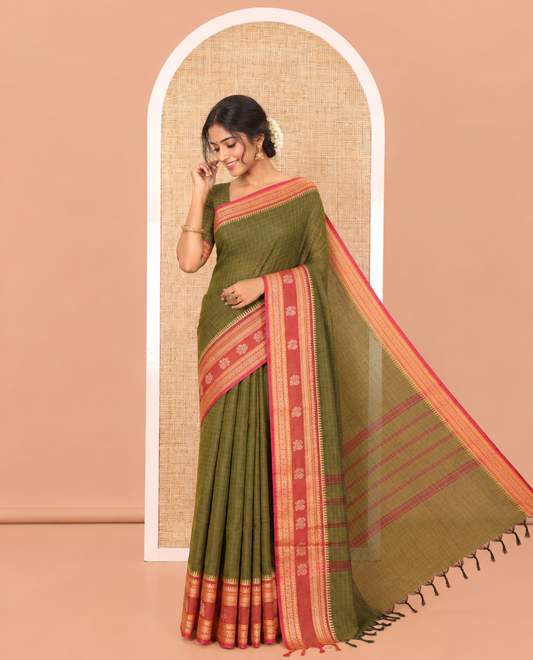 Green Chettinad Cotton Saree, Subtly Sparkled with Checks on Its Body, Complemented by a Contrast Traditional Border of Peacock Designs, Subtly Striped Pallu, and Paired with a Matching Blouse