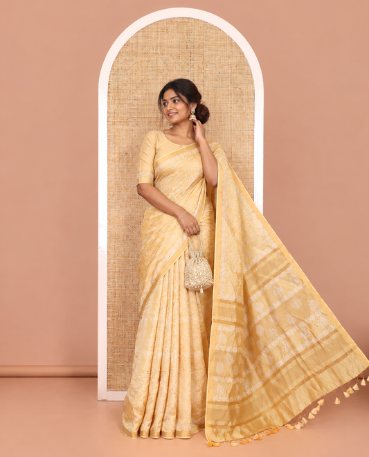 Gold tree motifs printed banana pith saree, zari piping border, floral printed pallu, and a matching printed blouse