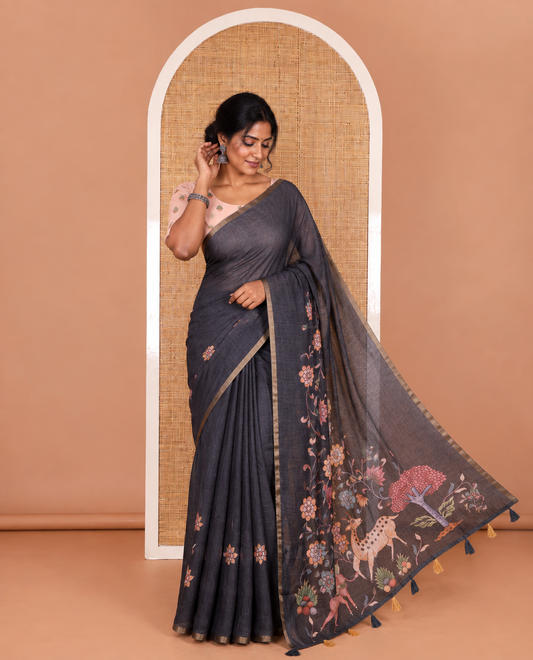 Black kalamkari floral vine, horse, and deer motifs printed linen cotton saree, piping border, printed pallu, and a contrast printed blouse