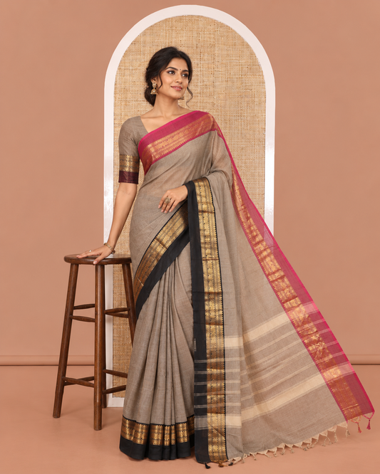Light Brown Plain Chettinad Cotton Saree, Complemented by a Contrast Kal Erangina Traditional Zari Border of Peacock Designs, Subtly Striped Pallu, and Paired with a Matching Blouse