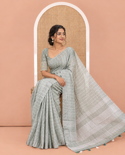 Green Jute Linen Cotton Saree, Adorned with Checked Design on Its Body, a Subtle Self-Border, Striped Pallu, and Paired with a Matching Thread Embroidered Blouse