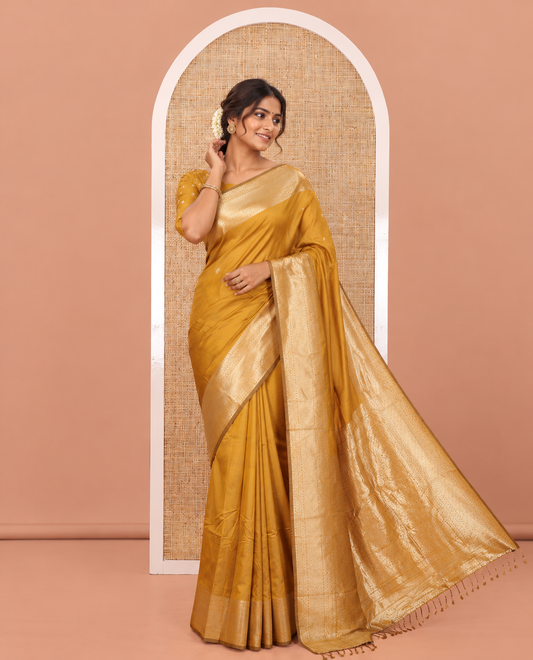 Mustard Plain Semi-Soft Silk Saree, Enriched with Traditional Zari Designs Woven Border, Grandly Woven Pallu Steeped with Chakram Designs, and Paired with a Matching Blouse