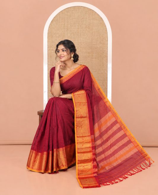 Purple Mercerised Cotton Saree, Complemented by Contrast Traditional Design Temple Border, a Subtly Striped Pallu, and Has a Matching Blouse