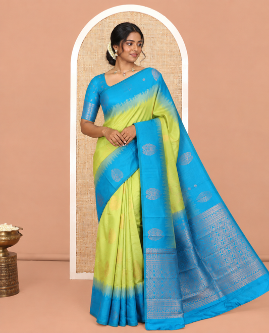 Parrot Green Kanchi Silk Saree, Adorned with Zari Buttas, a Contrast Zari Butta Border, Grand Pallu, and a Contrast Blouse