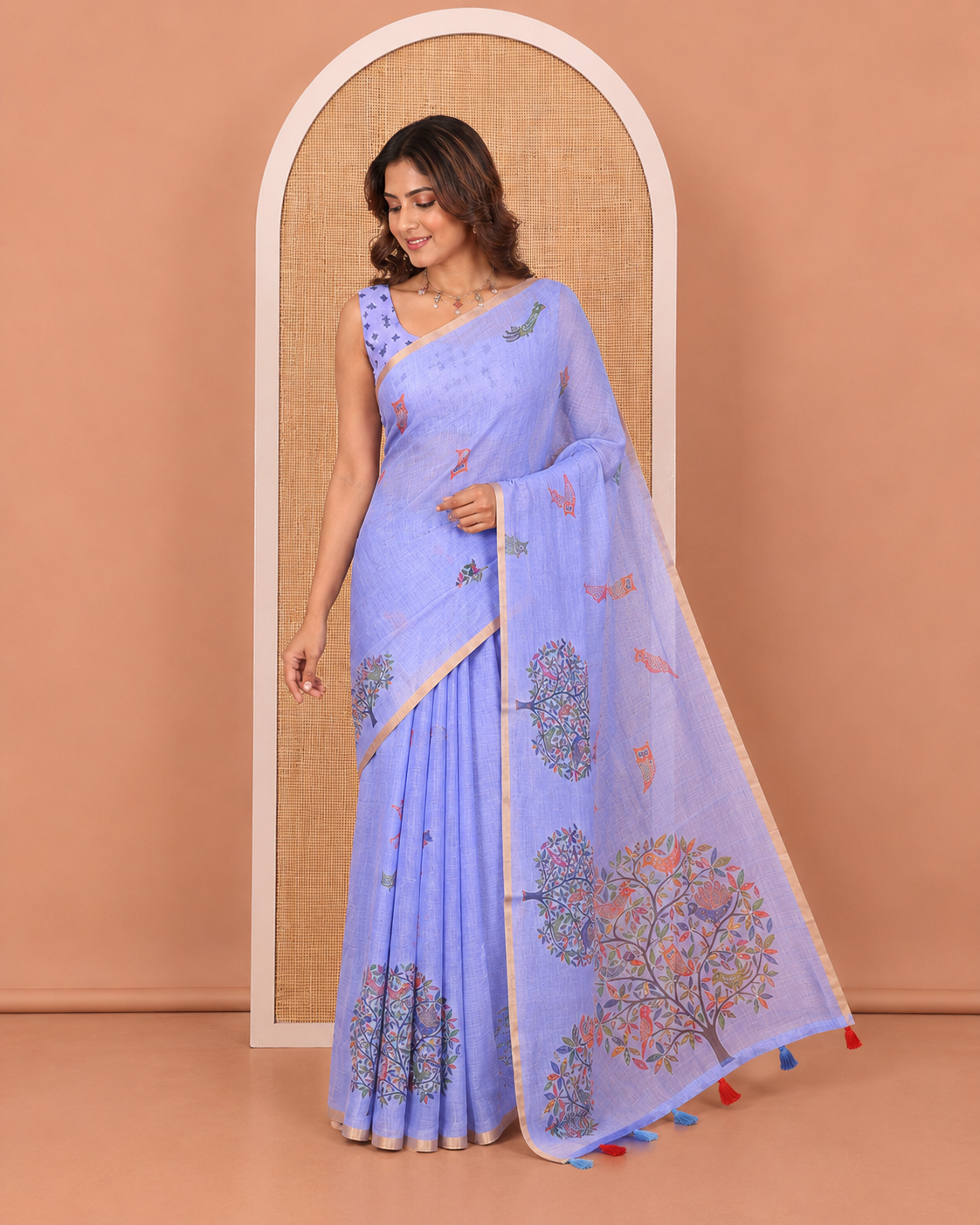 Blue Linen Cotton Saree, Steeped in the Richness of Nature-Themed Motifs Like Bird, Owl, and Tree, a Subtle Piping Border, Pallu of Tree Motifs, and Paired with a Matching Blouse