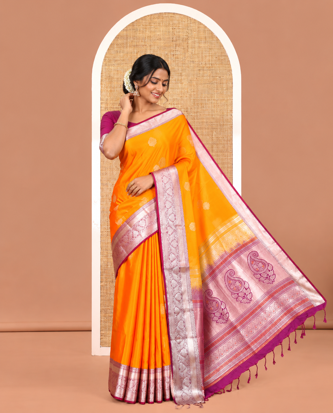Fanta Orange Semi-Soft Silk Saree, Gleamed Up with Zari Buttas All Over Its Body, Complemented by a Contrast Traditional Zari Design Border, Intricately Designed Pallu, and Paired with a Contrast Blouse