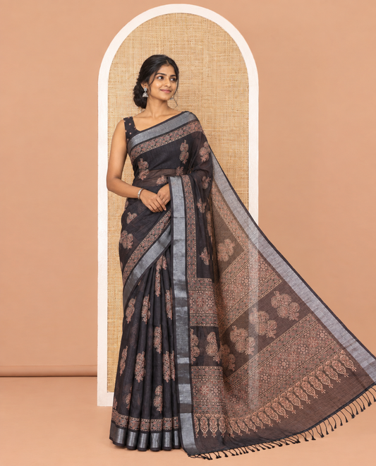 Black Linen Cotton Saree, Subtly Enriched with Ajrakh-Style Floral Motifs Block Print, a Subtle Zari Border, Pallu of Ajrakh-Style Intricate Print, and Paired with a Matching Blouse