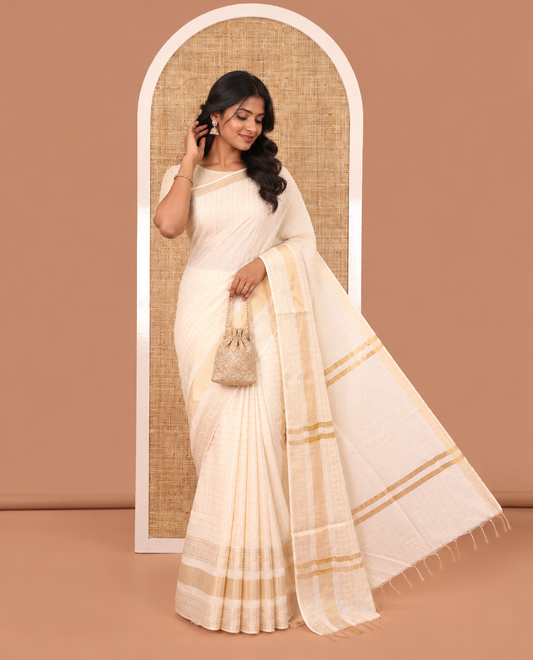 Cream Bhagalpuri Cotton Saree, Adorned with Butta Enclosed Checks, a Traditional Zari Border, and a Matching Blouse