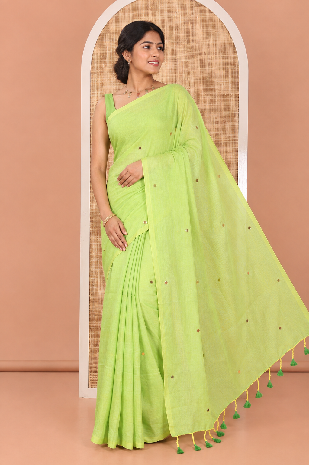 Borderless Parrot Green Mul Cotton Saree, Subtly Sparkled With Big Sequins Work On Its Body, a Self-Pallu and Paired with a Matching Blouse