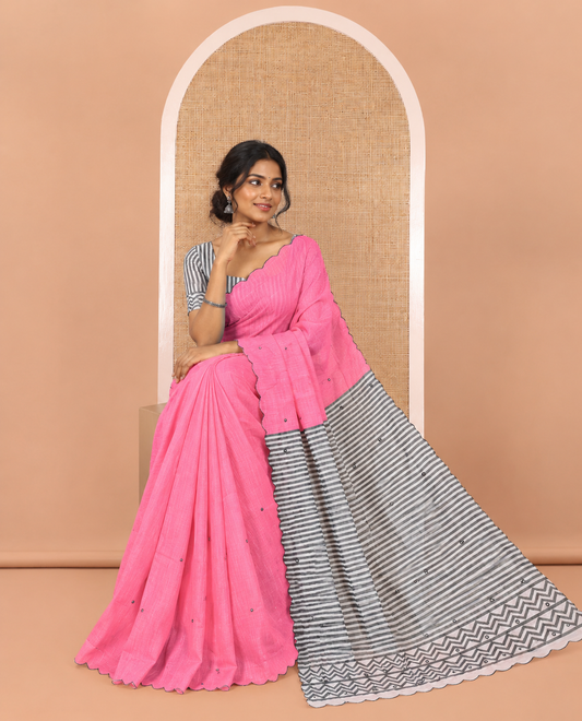 Pink Linen Cotton Saree, Bedecked with Mirror Work All Over Its Body, Subtly Scallop Border, Complemented by Contrast Pallu of Stripes and Mirror Work, and Paired with a Contrast Geometric Printed Blouse
