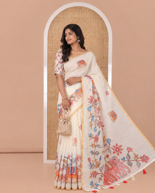 Cream Linen Cotton Saree, Bedecked with Elephant Motifs Printed on Its Body, Subtle Piping Border, Pallu of Floral and Elephant Designs, and Paired with a Matching Blouse