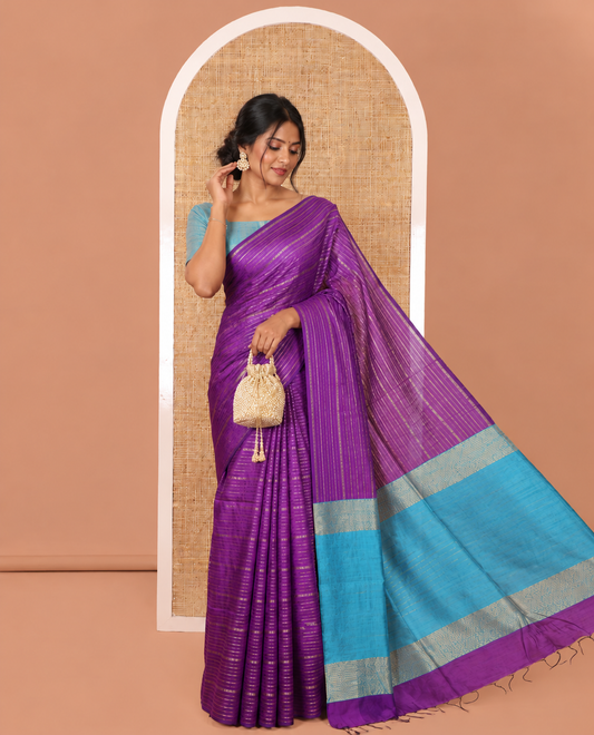 Borderless Dark Violet Semi-Raw Silk Saree Embellished with Gold-Zari Horizontal Stripes All Over Its Body, Complemented by a Contrast Pallu of Stripes, and Paired with a Contrast Blouse
