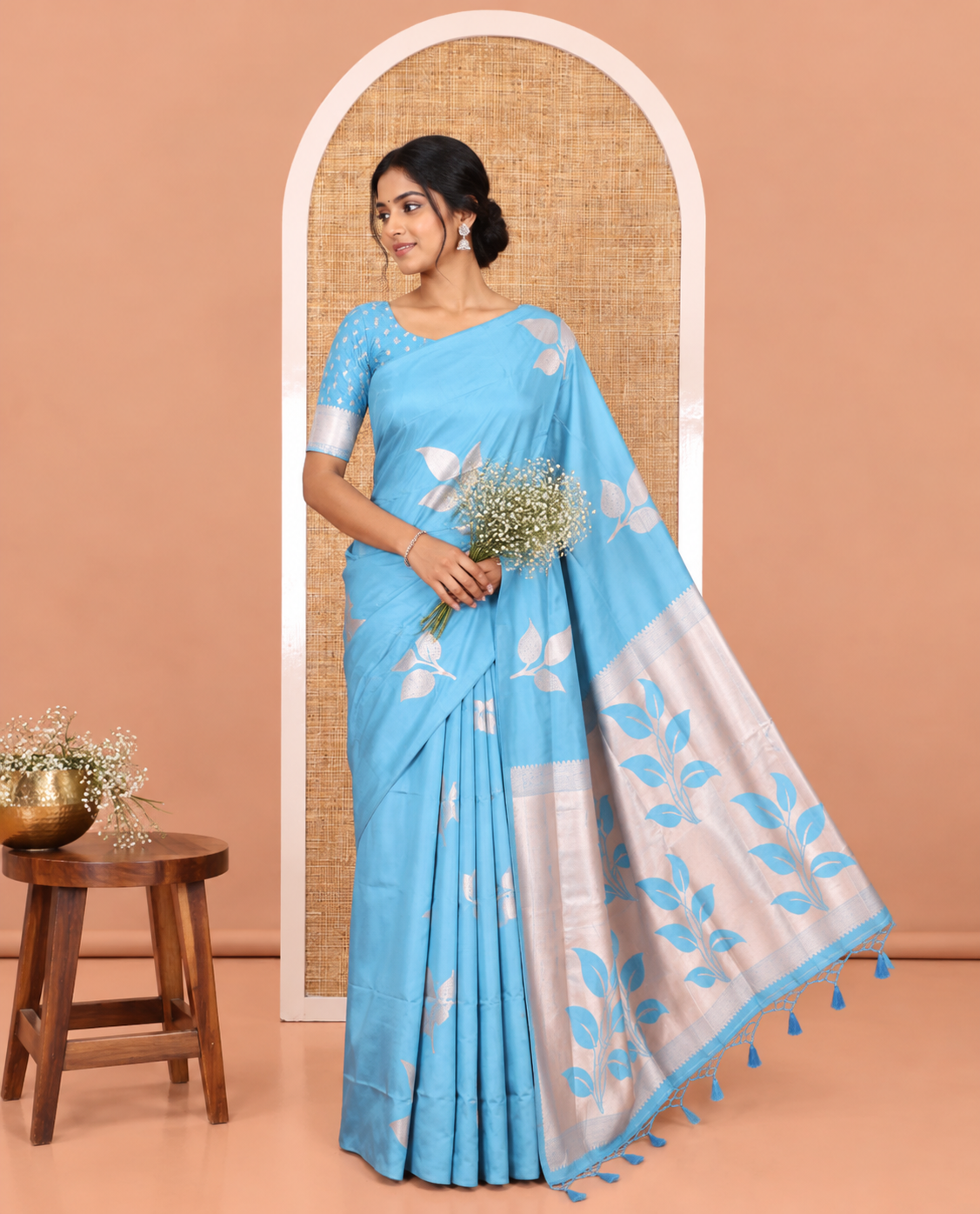 Borderless Blue Elite Soft Silk Saree, Detailed with Leaf Motifs, a Self-Pallu of Floral Designs, and a Matching Blouse