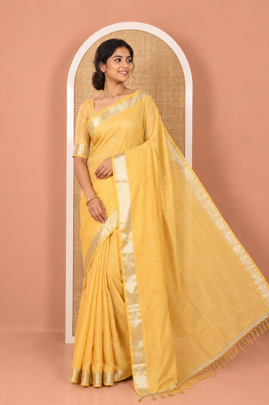 Yellow Linen Zari Cotton Saree, Gleamed Up with Zari Stripes All Over Its Body, a Subtle Zari Border, a Self-Pallu, and Comes Without a Blouse