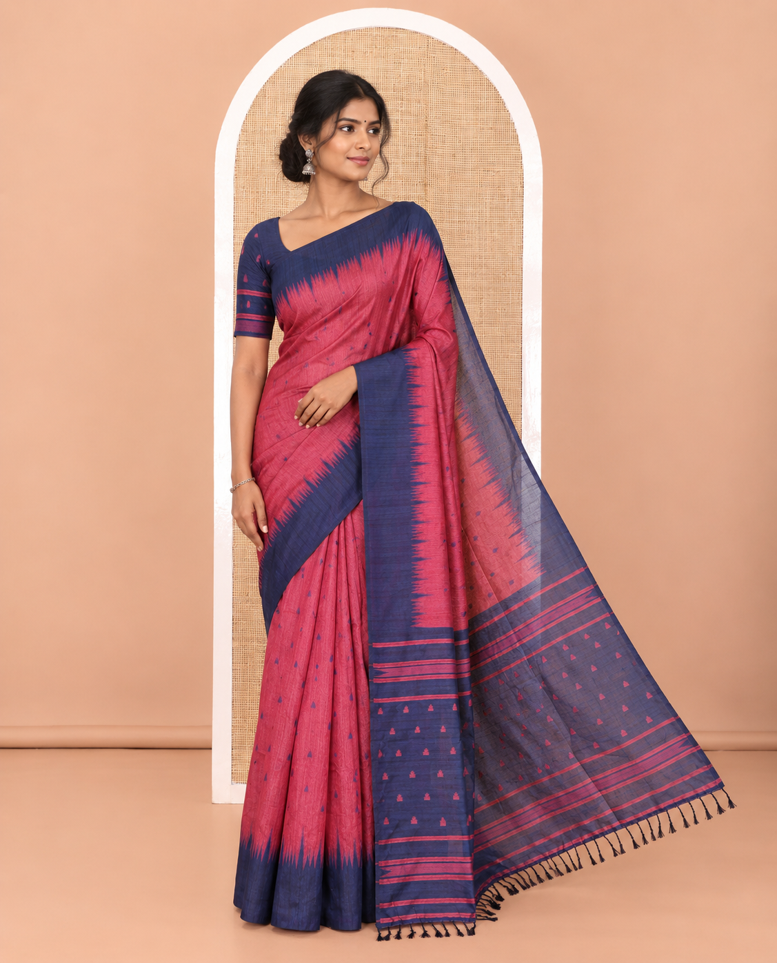 Pink buttas semi-jute saree with contrast temple border, thread striped pallu, and a contrast thread buttas blouse