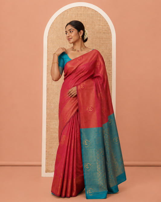Maroon Art Kanchi Silk Saree, Adorned with Vaira Oosi and Zari Buttas, a Traditional Zari Border, Contrast Jaal Pallu, and a Contrast Blouse