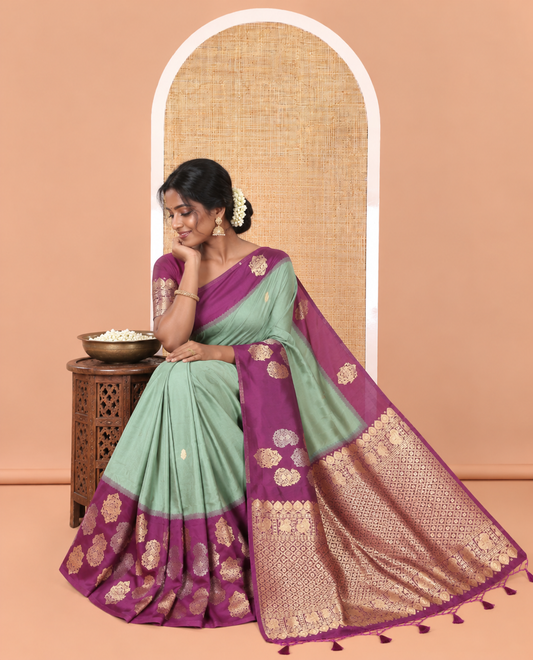 Green Elite Soft Silk Saree, Elevated with Zari Buttas All Over Its Body, Complemented by Contrast Border Steeped with Zari Buttas, Grand Jaal Design Pallu, and Paired with a Contrast Blouse