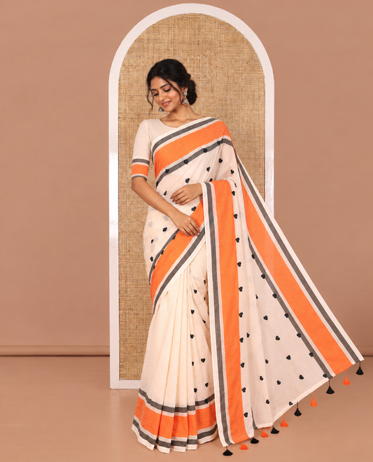 Peach Khadi Mul Cotton Saree Mesmerized with Heart Motifs Embroidery All Over Its Body, Complemented by a Contrast Plain Border, Pallu Steeped with Heart Motifs Embroidery, and Paired with a Matching Blouse