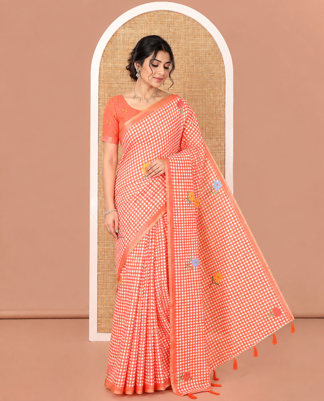 Orange Linen Cotton Saree, Decked up with Micro-Checks and Floral Motifs on Its Body, Subtle Piping Border, a Self-Pallu, and Paired with a Rose Floral Printed Blouse