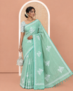 Green South Cotton Saree Features Butterfly Motifs, a Block-Printed Border, and a Contrast Blouse