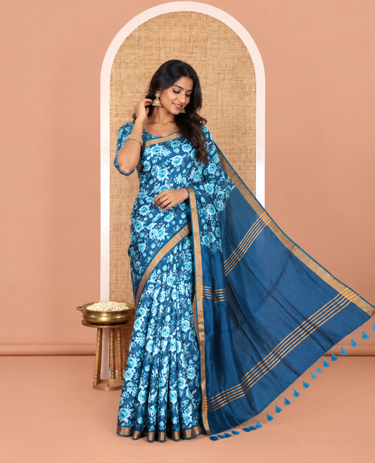 Blue floral motifs digital printed banana pith saree, zari piping border, striped pallu, and a matching floral printed blouse