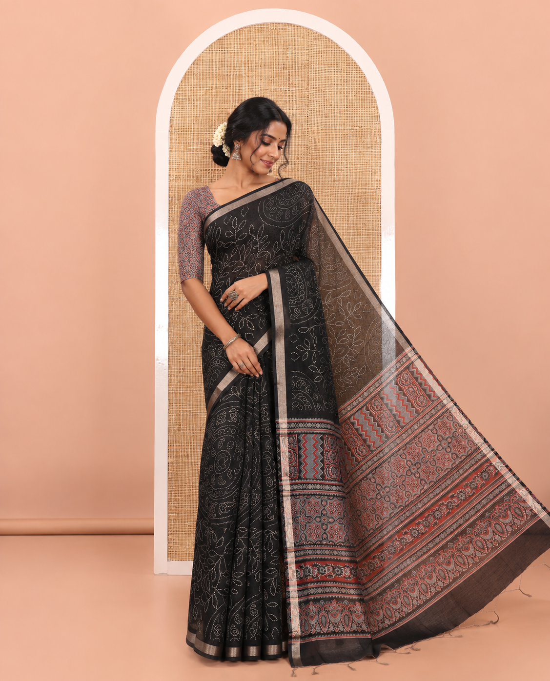 Black bandhani-style floral and chakra printed saree, zari piping border, contrast ajrakh printed pallu, and contrast ajrakh printed blouse