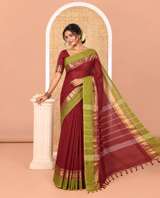 Maroon Plain Chettinad Cotton Saree, Complemented by Contrast Traditional Zari Temple Border, Subtly Striped Pallu, and Paired with a Matching Blouse