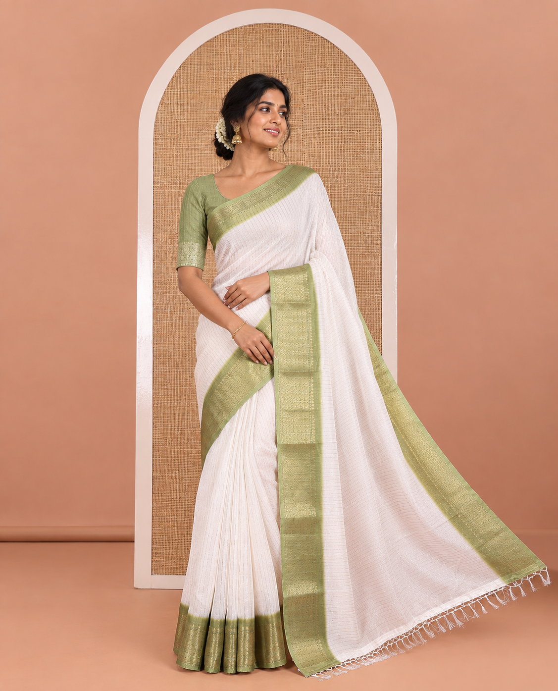 White and Green Dola Silk Saree Elevated with Vertical Zari Stripes All Over the Body, Complemented by a Contrast Border of Traditional Zari Designs, Self-Pallu of Stripes, and Paired with a Contrast Blouse