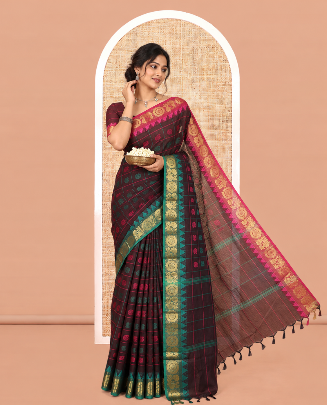 Brown Chettinad Cotton Saree Features Butta Enclosed Checks, a Contrast Temple Annam-Peacock Ganga-Jamuna Border, and a Matching Blouse