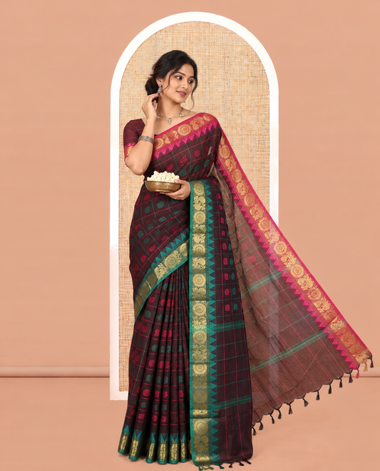 Brown Chettinad Cotton Saree Features Butta Enclosed Checks, a Contrast Temple Annam-Peacock Ganga-Jamuna Border, and a Matching Blouse