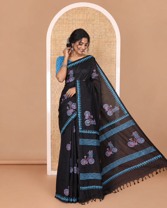 Black cycle with flower basket motifs block printed South cotton saree, Greek key motifs block printed border, a matching blouse, and a contrast floral motifs printed blouse